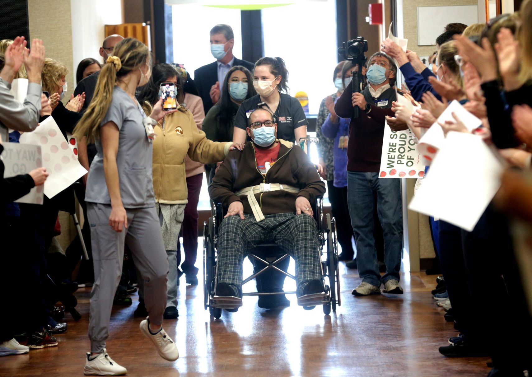 Staff cheers as COVID-19 survivor Joshua Miller discharged from St. Luke's Hospital